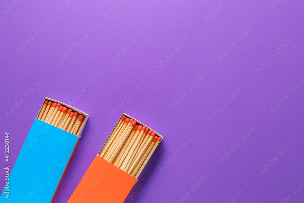 Different boxes with matches on color background
