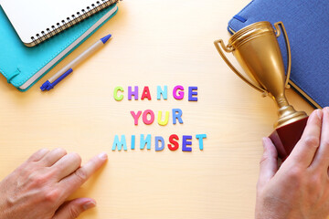 Poster - concept image with change your mindset text. top view of office table