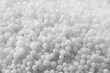 © New Africa - Pellets of ammonium nitrate as background, closeup. Mineral fertilizer
