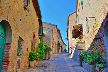 old alley in the village of Castiglione della Pescaia, a famous medieval town overlooking the Tuscan coast in the province of Grosseto, Italy