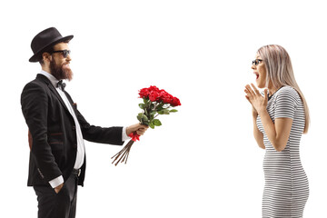 Sticker - Bearded man in a suit giving a bouquet of red roses to a surprised woman