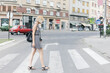 © Marija Kovac/Stocksy - Blonde woman crossing the street
