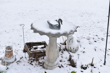 Poster - Snow Covered Bird Bath in a Yard