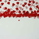 Fototapeta Kwiaty - A red heart shaped confetti border with copy space.