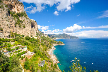 Wall Mural - The rugged coastline of southern Italy along the Amalfi Coast with beaches, boats, caves and mountains, near Sorrento and Amalfi.