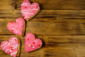 Wall Mural - Heart shaped cookies on wooden table. Top view, copy space. Dessert for Valentine day