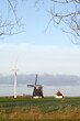 © Marcel/Stocksy - Old and new windmill
