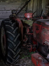 Detail: Large Tractor Tire And Driver's Seat.
