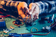 © Aila Images/Stocksy - Man working with electrial components