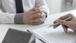 © Puwasit Inyavileart - Real estate agent or sales manager has proposed terms and conditions to customers who sign house purchase agreements with insurance, Agreement to sign the purchase contract concept.