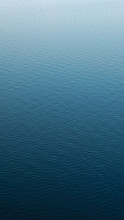 Vertical Photography Of A Calm Water Surface