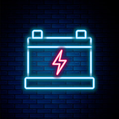 Glowing neon line Car battery icon isolated on brick wall background. Accumulator battery energy power and electricity accumulator battery. Colorful outline concept. Vector.