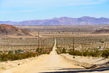 Long straight dirt road at California, USA.