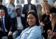 © ASDF - Young black woman smiling to camera in office
