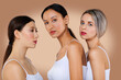© boomeart - Multi-ethnic beauty concept. Beautiful asian, caucasian and african girls with different types of skin in white panties and shirt.