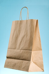 Wall Mural - Empty brown paper shopping bag with Handles.