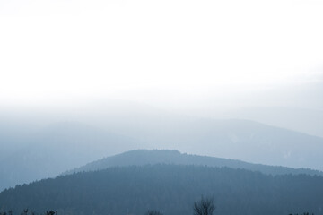 Wall Mural - View from a hill on snowy landscape