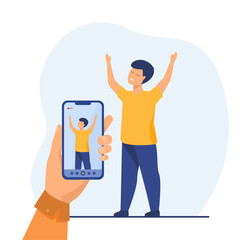 Poster - Hand holding phone and taking photo of little boy. Smartphone, kid, moment flat vector illustration. Memory and digital technology concept for banner, website design or landing web page