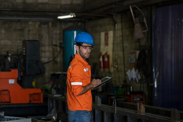 Aufkleber - Engineer or factory worker using digital tablet checking inspecting metal component at machine in factory.