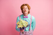 Photo portrait of gentleman with mustache red hair giving flowers kissing on date isolated on pastel pink color background