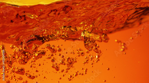 Detail of golden alcoholic drink with bubbles © Jag_cz