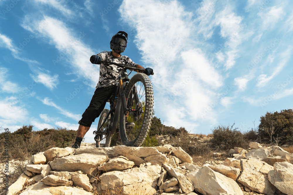 Professional bike rider during downhill ride on his bicycle Stock Photo ...
