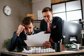 Colleagues in office. Two businessman discussing work in office...