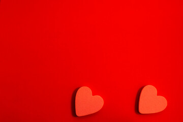 pattern of red hearts on a red background with bright light. creative idea with heart. love concept