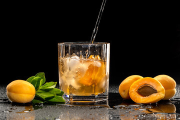 Cold summer cocktail with fresh apricots