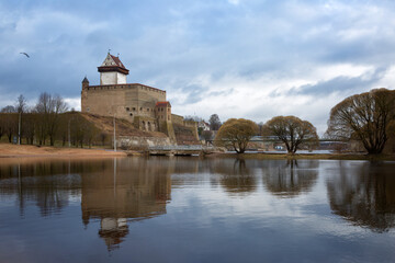 Wall Mural - View of Narva Castle with tall Herman's tower in april day. Estonia