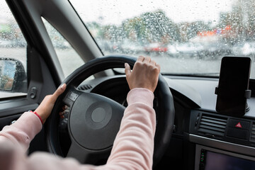 online map, navigator in mobile device and trip in city in bad weather