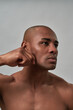 © Svitlana - Focused citizen swiping his palm along the cheek
