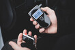 a man with a breathalyzer in the car, testing for alcohol and drug intoxication of the driver, selective focusing tinted image