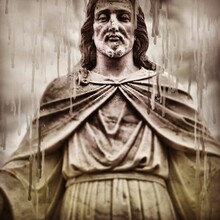 Melting Jesus Statue In The Rain