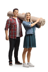 Young man and woman carrying a carpet