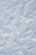 © Сyrustr - Fresh clean white snow background texture. Winter background with frozen snowflakes and snow mounds. Snow lumps. Seasonal landscape details. Cold weather.