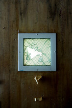 Broken Glass On Seclusion Room Door Inside An Abandoned Asylum 