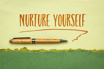 Wall Mural - nurture yourself - inspirational handwriting on a handmade rag paper, self care concept
