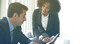 © glowonconcept - Happy colleague African woman and Hispanic man consulting work positive attitude banner