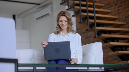 Poster - happy businesswoman finish project happy smiling enjoy sitting on the white sofa slow motion