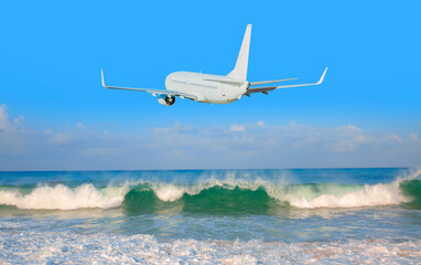 White passenger airplane flying away in to sky high altitude during bright blue sky