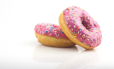 Wall Mural - Two pink donuts on a white background