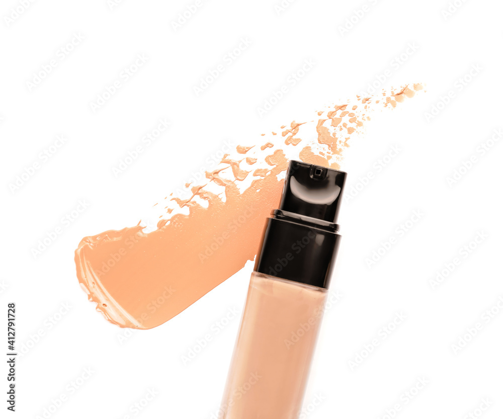 Bottle of makeup foundation and sample on white background