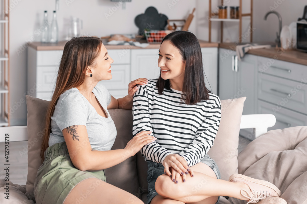 Young lesbian couple resting at home