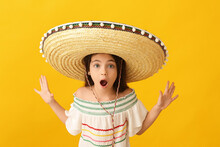 Surprised Mexican Girl In Sombrero Hat On Color Background
