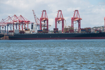 Container Ship Moored in Harbour Loading Cargo