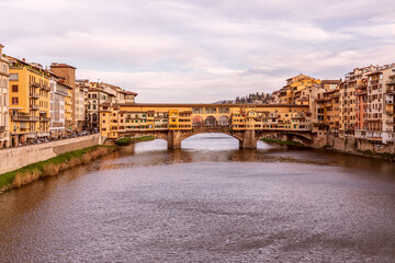 Poster - Beautiful evening over the famous bridge Ponte Vecchio over Arno river in Florence, Italy