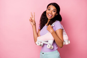 Poster - Profile side view portrait of lovely funny cheerful girl carrying rollers showing v-sign isolated over pink pastel color background