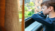 © David Pereiras - Sad boy in coronavirus lockdown looking through the window