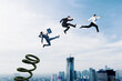 © Creativa Images - Three business people use a springboard to jumping